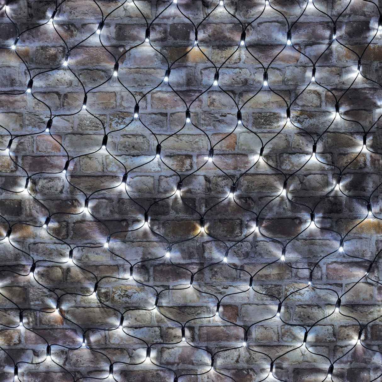 LYYT 240 LED cool white net light draped across an exposed brick wall, showing the 2m x 2m black cable mesh with evenly spaced lit LEDs.