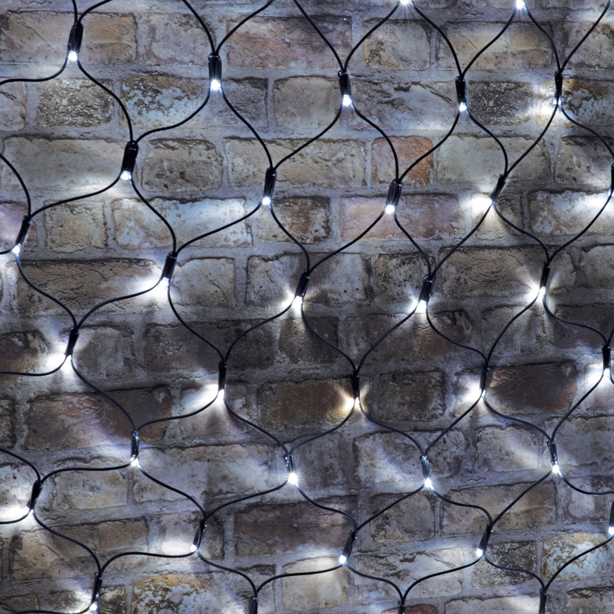LYYT 240 LED net light with cool white bulbs on black rubber cable mesh, draped across a rustic exposed brick wall.