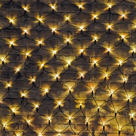 LYYT 240 LED net light with warm white bulbs on a black cable grid, draped across an exposed brick wall for outdoor decorative coverage.