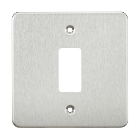 The Flat Plate 1 Gang Grid Faceplate in brushed chrome is crafted from premium grade steel and includes a rectangular cutout in the center with two screw holes, one at the top and one at the bottom.