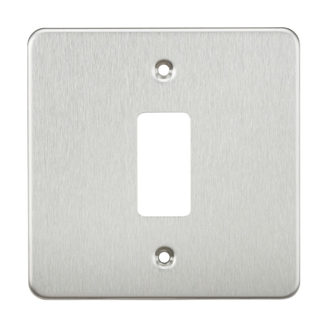 The Flat Plate 1 Gang Grid Faceplate in brushed chrome is crafted from premium grade steel and includes a rectangular cutout in the center with two screw holes, one at the top and one at the bottom.