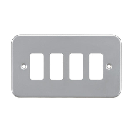 The Metalclad 4 Gang Grid Faceplate is a rectangular, powder-coated silver/grey light switch cover with rounded corners, featuring two screw holes and crafted from premium grade steel to accommodate four switches.