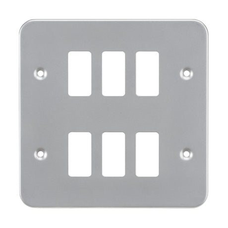 The Metalclad 6 Gang Grid Faceplate is a silver electrical wall plate made from premium grade steel, featuring six rectangular openings arranged in a two-column layout. It includes four screw holes, one in each corner, for secure mounting.