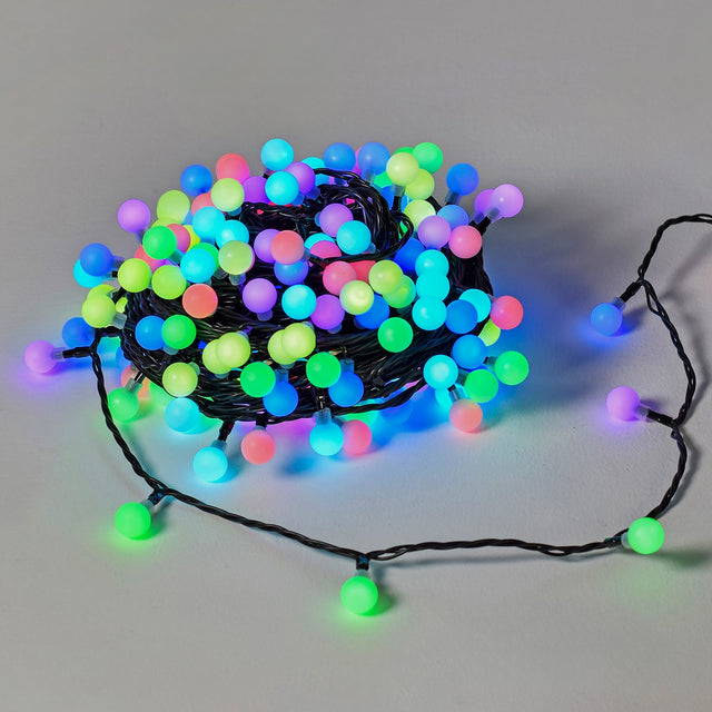 LYYT 20m multicolour berry string lights coiled on a plain background, illuminated with pink, blue, green and purple round LED globes on a dark cable.