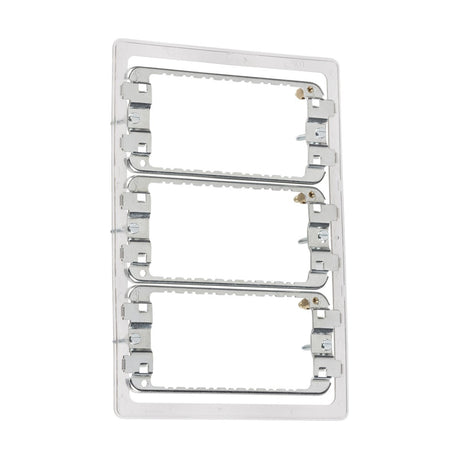 The 9-12 Gang Grid Mounting Frame For Screwless is a vertical mounting bracket made from premium grade steel. It includes cutouts for accommodating electrical outlets or switches and features a sleek silver finish with visible mounting holes, designed for compatibility with Screwless Grid Faceplates to ensure a seamless appearance.