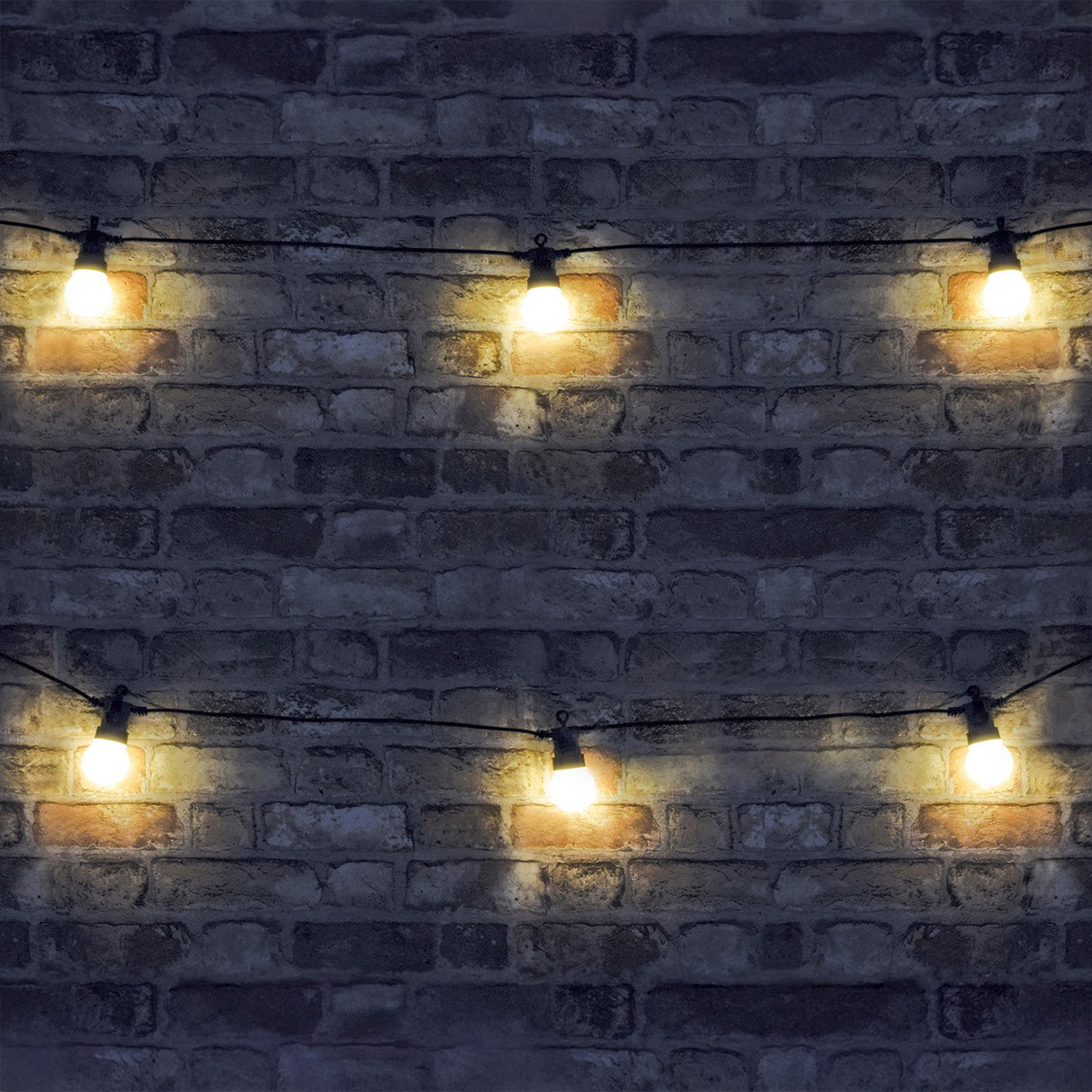 LYYT 10m festoon string with ten warm white LED globes on black cable, draped across a dark brick wall in an outdoor setting.