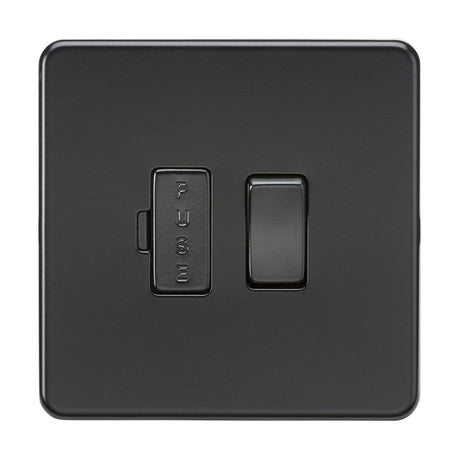 The 13A Switched Fused Spur Unit in matt black boasts a premium-grade steel body with a right toggle switch and left rectangular FUSE holder. Its screwless, sleek design enhances any space by blending style with functionality.