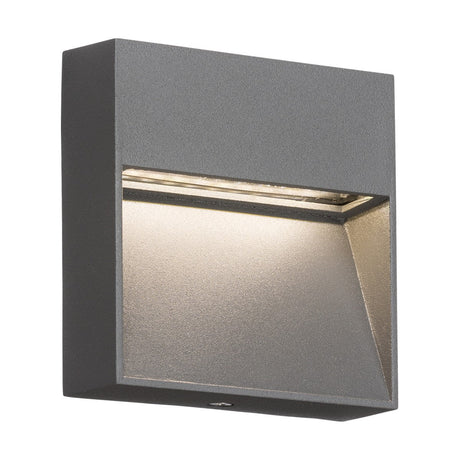 Introducing the Outdoor 3W LED Square Guide Light in Grey: a contemporary wall sconce made from die-cast aluminum, featuring a sleek, dark gray finish. This modern LED light is designed with a recessed lamp to cast a warm, downward glow. Its minimalist aesthetic complements both indoor and outdoor spaces and includes an IP44 weather rating for durability.