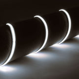 LYYT 24V COB LED strip by AVSL, spiraled around a dark cylinder, emitting continuous 6500K cool white light from flexible silicone tape.