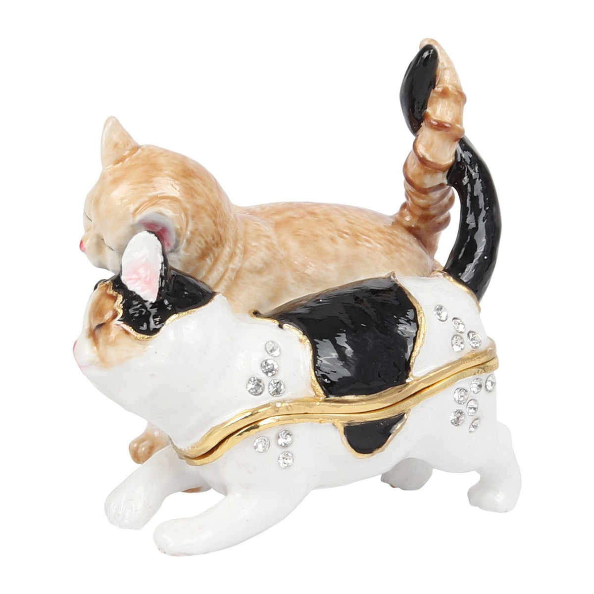 Hinged metal trinket box shaped as two nuzzling cats with twisted tails, one ginger tabby and one white with black patches, crystal accents on white body, plain white background.