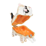 Hinged metal trinket box shaped as two cats with twisted tails, one ginger and white tabby and one white with black patches, open to reveal an orange enamel interior, on a white background.