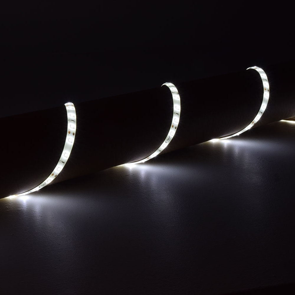 LYYT 12V SMD2835 LED strip light draped over a cylindrical surface, glowing cool white 6000K light along the flexible IP65 tape in a dark setting.