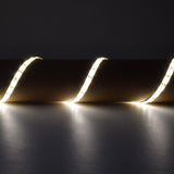 LYYT 5m warm white LED strip light by AVSL, draped in curved loops emitting 3000K glow against a dark grey backdrop.