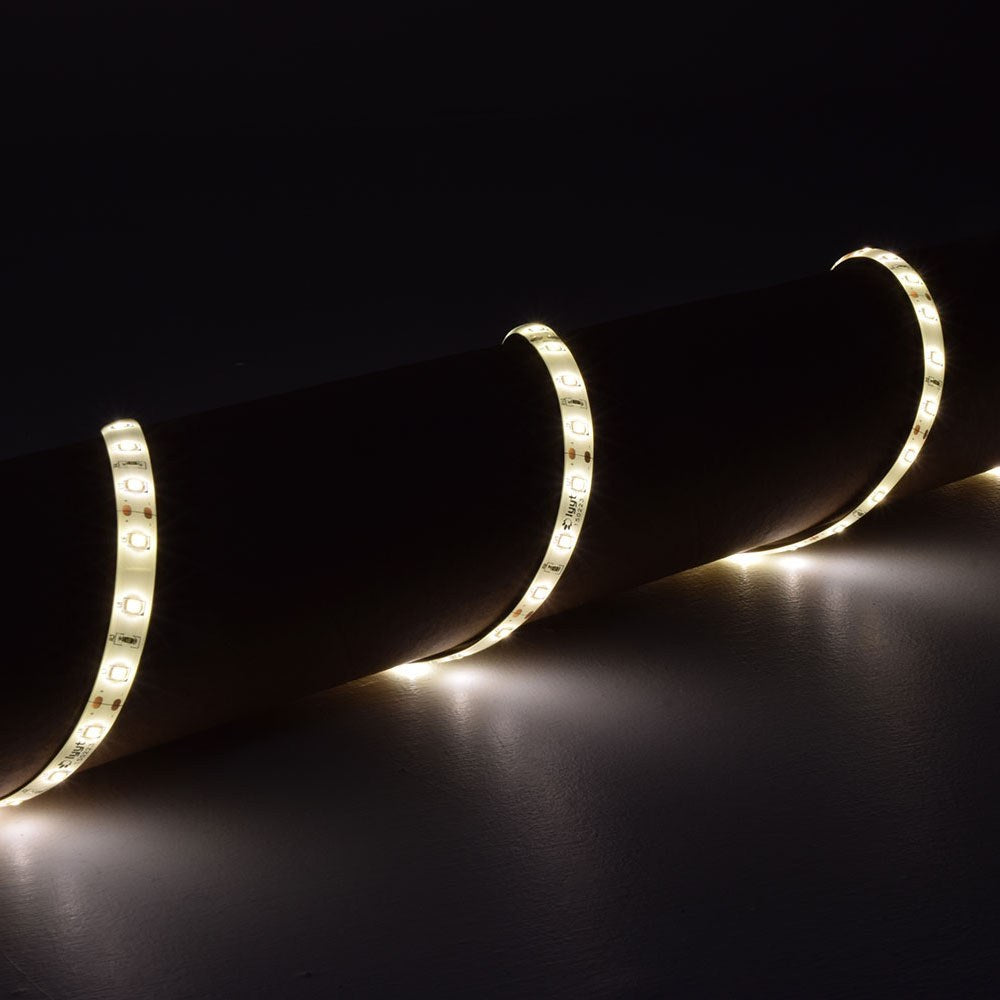 LYYT 12V SMD2835 LED strip light wrapped around a dark cylindrical form, emitting warm white 3000K light along the flexible IP65 tape.