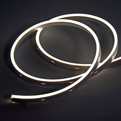 LYYT SideBend NW 30m side-bendable LED tape by AVSL, coiled and lit in natural white against a dark background, showing its slim frosted extrusion.