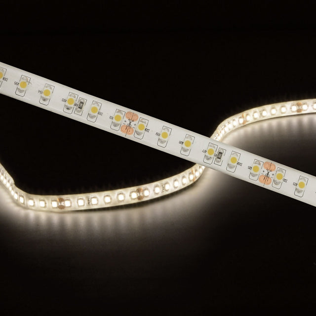 LYYT LT245120-NW natural white IP65 LED strip by AVSL, shown illuminated and coiled with visible SMD LEDs and cut marks against a black background.
