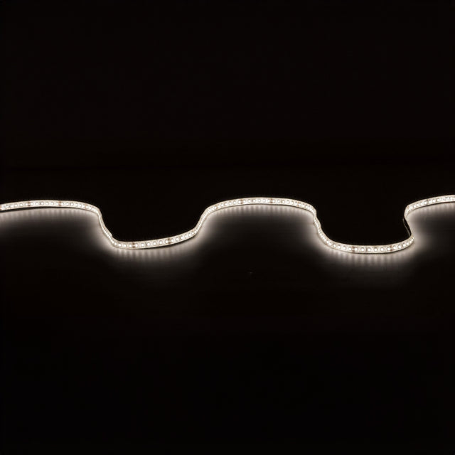 The LYYT 24V High Output LED Strip Light 5m - 4000K softly illuminates against a dark background, forming gentle curves across the image. This water-resistant LED light, with high luminous flux, casts a white glow that contrasts sharply with the black backdrop, showcasing its undulating design and ensuring easy installation anywhere.