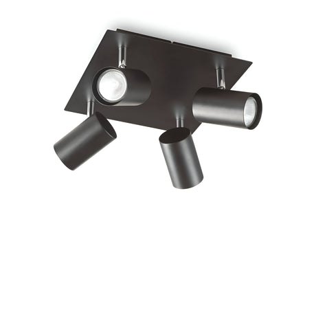 The Radiatrix Quad Spotlight - Black is a modern ceiling-mounted lighting fixture that boasts adjustable spotlights with four cylindrical lights on a square base in a matte black finish.