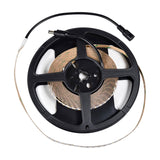LYYT 24V High Output LED Strip Light in 3000K warm white on a 5m black reel with pre-fitted 2.1mm DC plug and socket connectors.