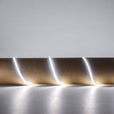 LYYT 24V high output LED strip light in 6000K cool white, shown illuminated and coiled to display the flexible tape with densely spaced SMD LEDs.
