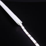 LYYT 90° arc corner LED profile illuminated with frosted diffuser and exposed LED tape extending from the aluminium channel on a black background.