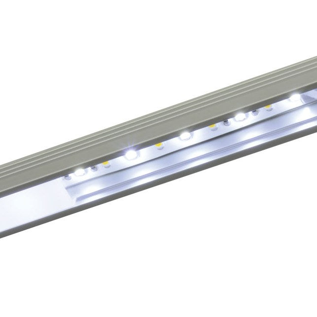 LYYT 2m surface mount LED profile by AVSL in silver aluminium, illuminated with white LEDs along the opal diffuser channel.