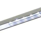 LYYT 2m surface mount LED profile by AVSL in silver aluminium, illuminated with white LEDs along the opal diffuser channel.