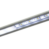 LYYT 2m recessed aluminium LED strip profile by AVSL shown illuminated, with a silver channel and lit diffuser revealing individual white LEDs.