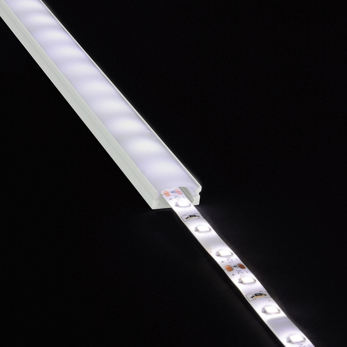 LYYT Short Crown 2m surface mount LED profile with lit LED strip partially inserted into the frosted aluminium extrusion, shown on black.