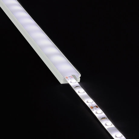 LYYT Short Crown 2m surface mount LED profile with lit LED strip partially inserted into the frosted aluminium extrusion, shown on black.