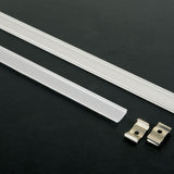 LYYT bendable 1m aluminium LED strip profile by AVSL shown with opaque push-fit diffuser and two metal mounting clips on a black background.