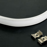 LYYT bendable surface mount LED strip profile in white curved aluminium with polycarbonate diffuser, shown with two silver metal mounting clips on black.