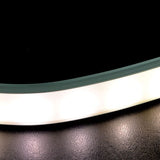 Close-up of the LYYT Bendable Surface Mount LED Strip Profile by AVSL, showing the curved aluminium channel and opaque white diffuser illuminated.