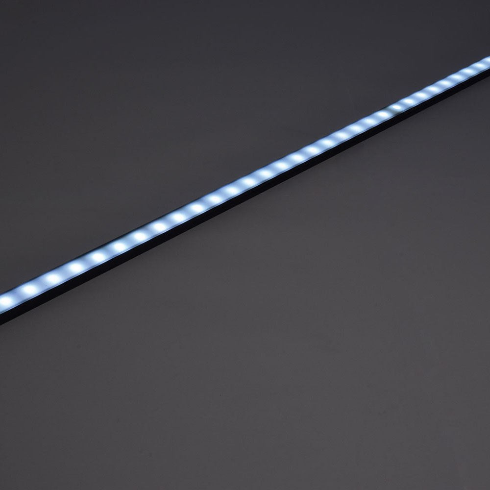 LYYT Short Crown 2m surface mount LED profile by AVSL, black aluminium extrusion shown illuminated diagonally with crowned diffuser on grey background.