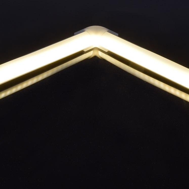 LYYT 90° Arc corner connector by AVSL joining two illuminated LED strip profiles at a right angle, showing the continuous warm light band across the bend.