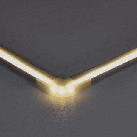 LYYT translucent corner connector by AVSL joining two warm white LED strip profiles at a 90-degree angle on a grey background.