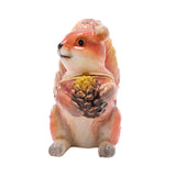 Red Squirrel and Pine Cone hinged metal trinket box in glossy russet brown with cream chest and paws, crystal accents along back and tail, gold-tone rim, on a white background.