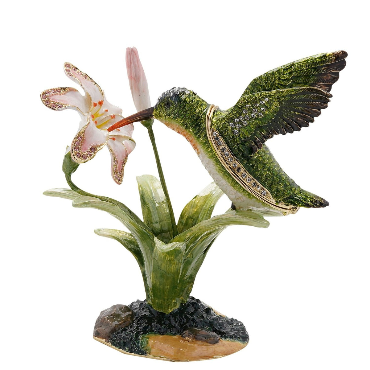 Glossy green metal trinket box featuring a jewelled hummingbird with white breast and orange throat perched beside a pink-and-white lily on a rocky base.