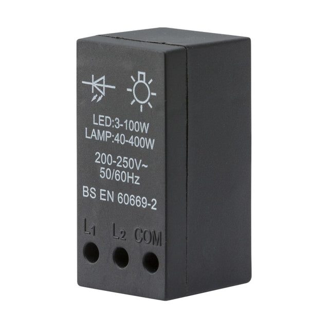 The 40-400W (3-100W LED) Leading Edge Dimmer Module is a black rectangular relay switch with white text, designed for use with 200-250V, 50/60Hz systems. It is suitable for dimming applications ranging from 3-100W LEDs to lamps at 40-400W. The module complies with BS EN 60669-2 standards and has an IP20 rating, featuring three connection ports labeled L1, L2, and COM.