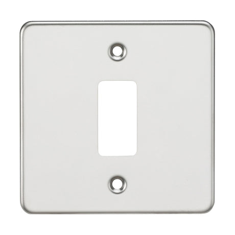 The Flat Plate 1 Gang Grid Faceplate - Polished Chrome offers a functional and stylish solution with its premium grade steel construction, featuring a central rectangular cutout and two strategically placed screw holes on a plain background, reminiscent of polished chrome finishes.
