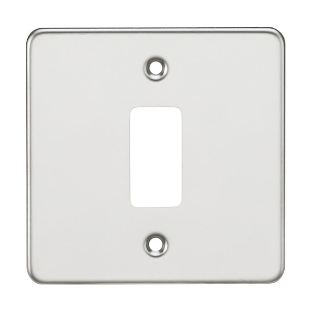 The Flat Plate 1 Gang Grid Faceplate - Polished Chrome offers a functional and stylish solution with its premium grade steel construction, featuring a central rectangular cutout and two strategically placed screw holes on a plain background, reminiscent of polished chrome finishes.