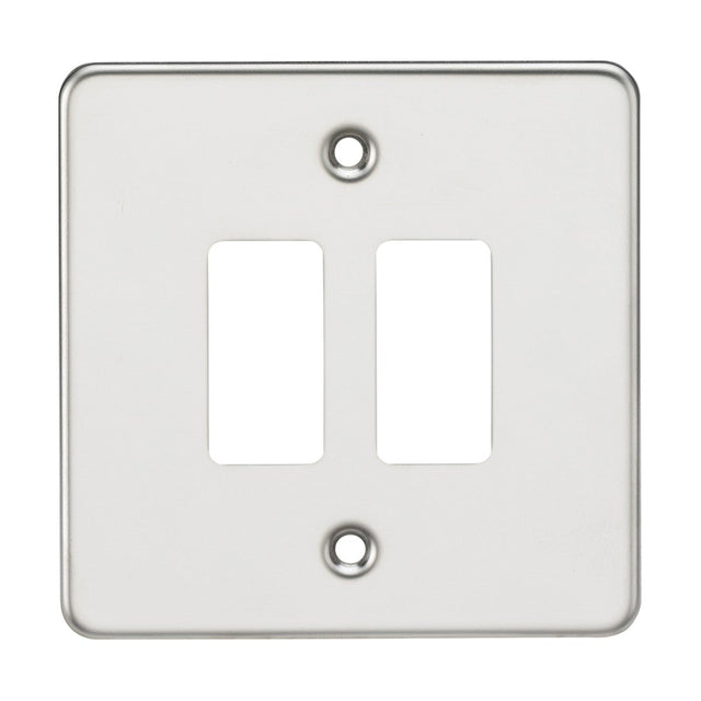 The Flat Plate 2 Gang Grid Faceplate in polished chrome is made from premium grade steel and includes two rectangular openings for switches, with mounting screw holes positioned at the top and bottom. Its smooth and shiny surface provides a sleek finish.