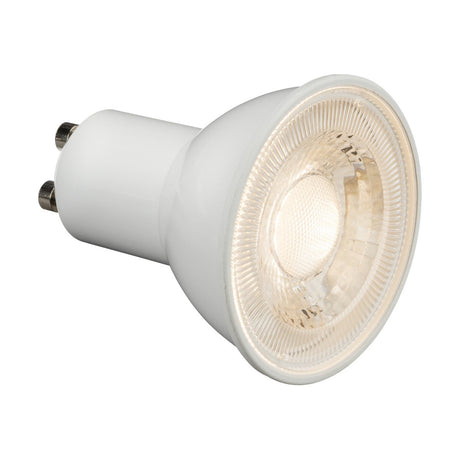 A close-up image of the 7W GU10 Dimmable LED Bulb - 3000K shows a white LED light bulb featuring a clear, faceted lens and a cylindrical body. The warm white glow adds elegance against the plain white background.