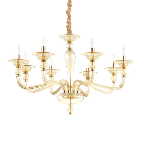 The Breeze Glass 8 Light Chandelier - Gold showcases an intricate design with a chrome finish, featuring eight candle-shaped lights on elegantly curved arms radiating from a central column. The glass shades add a touch of sophistication, and the fixture is suspended by a twisted gold chain.