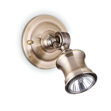 The Blink Wall Spotlight - Brass is a wall-mounted fixture crafted from brass, featuring a round base and an adjustable conical lamp head. Its classic metallic finish offers a stylish and versatile dimmable lighting solution, providing directional illumination for walls or ceilings to enhance any space.