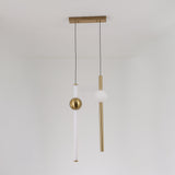 The Sottile LED Vertical Suspension Light - Gold features a modern minimalist design with two vertical rods—one white with a gold sphere and one gold with a white sphere—suspended from a gold rectangular ceiling mount for striking style.