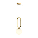 The Orvyn 1 Light Large Globe Alabaster Single Pendant Light features a soft white globe and brushed brass frame, suspended from a gold ceiling mount by a black cord.