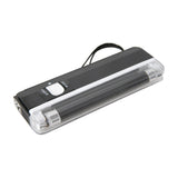 QTX BL135 mini black light UV torch lamp with matt black casing, sliding torch/tube switch, exposed UV tube, and hand strap on a white background.