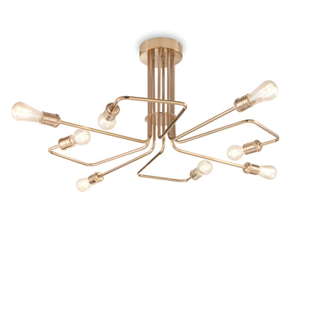 The Lustria 8 Light Ceiling Light in Brass showcases a sleek and artistic design with intertwined metal arms adorned with eight exposed, vintage-style bulbs. It has a modern semi-flush appearance, featuring a gold-toned finish that stands out against a white background.