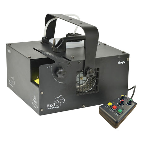 The QTX HZ-3 Haze Machine Digital Display - 700W, in black, is ideal for professional installations and DJ applications. It includes a handle, vents, and a control box with buttons and dials connected by a cable, making it expertly designed to create captivating mist or haze effects at any event.